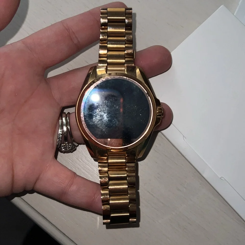 Michael kors smart watch with charger and paperwork